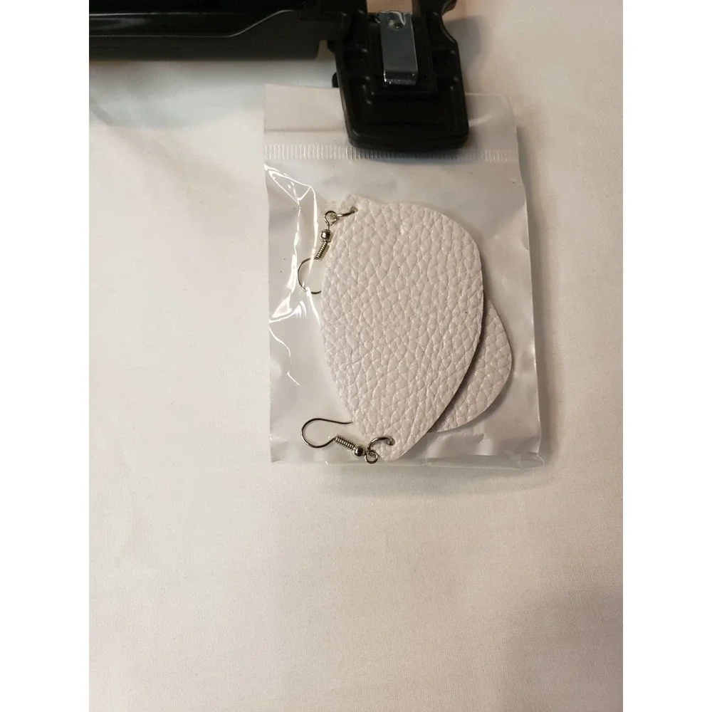 2 pair faux leather earrings. Gold and white. New in pkg.